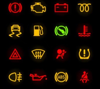Car dashboard with warning lights illuminated